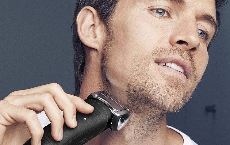 Man Shaving With Electric Razor